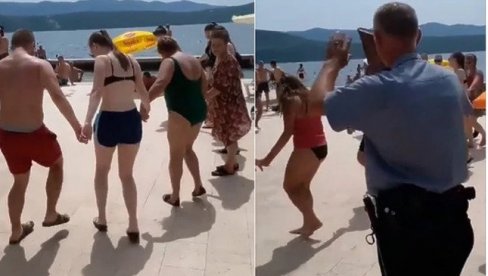 TURISTI NA PLAŽI U NEUMU ZAIGRALI KOLO: Zabavu prekinuo policajac (VIDEO)