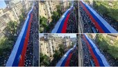 ПРИЗОР ОДУЗИМА ДАХ, НЕМОГУЋЕ ЈУ ЈЕ ЦЕЛУ СНИМИТИ: Српску тробојку носи 2.500 људи, дугачка је 500 метара, а тешка око тону (ФОТО/ВИДЕО)